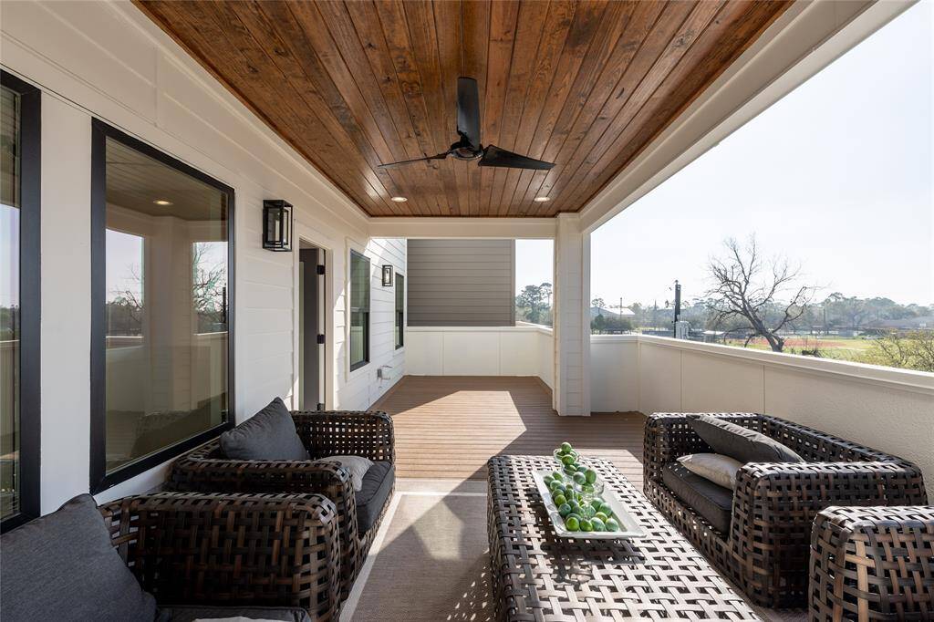 The covered design provides shade and protection while maintaining an uninterrupted connection to the outdoors.