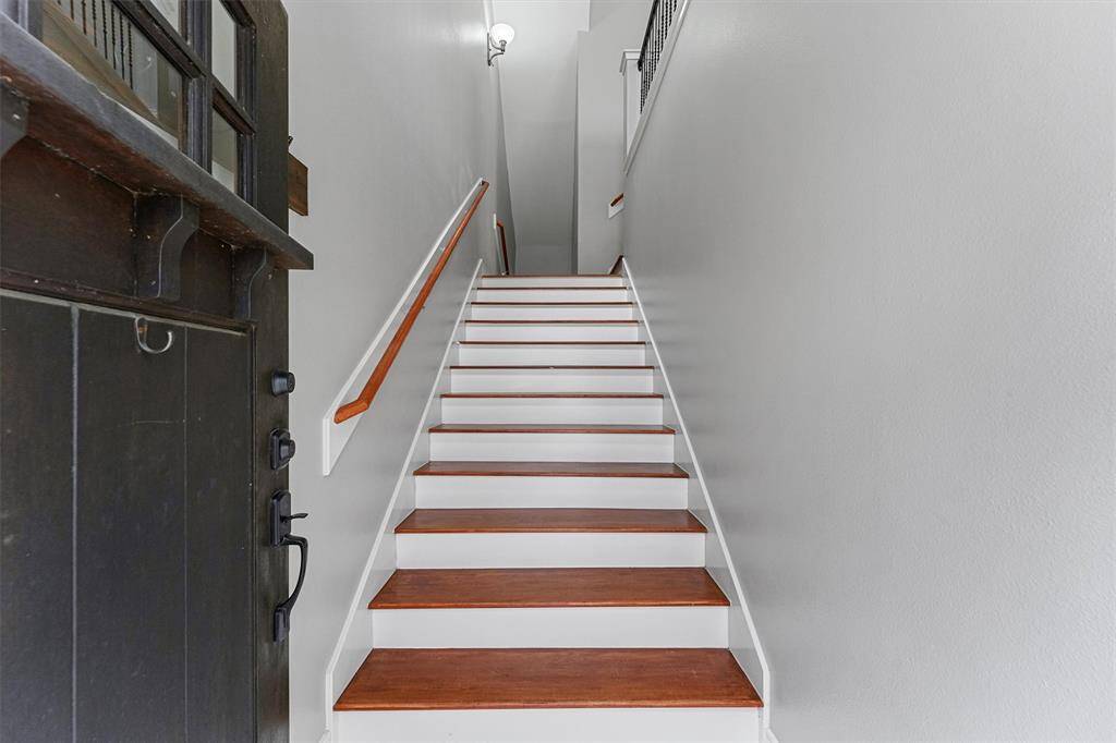 entry way is wide and features hardwood floors throughout