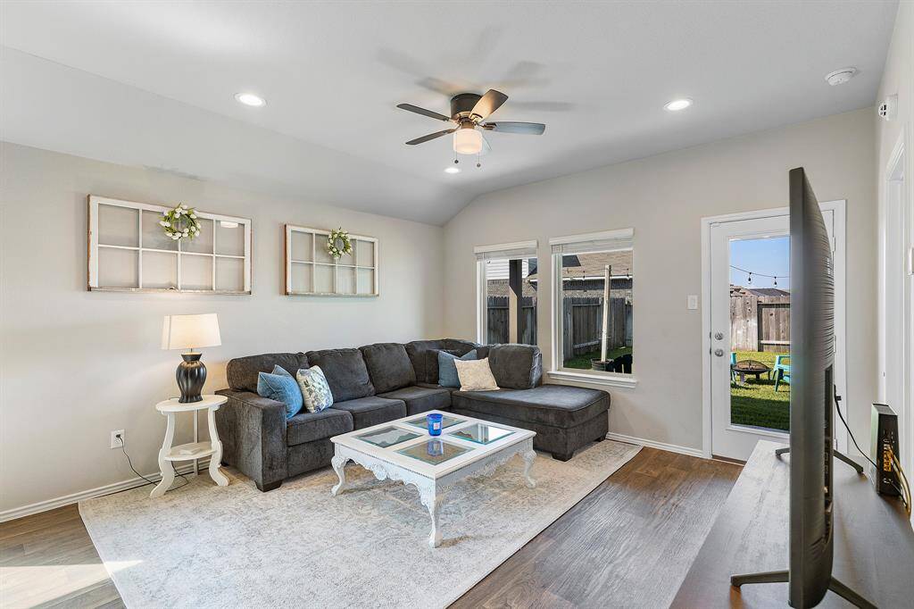 Step out to the backyard from your bright and airy living room—indoor-outdoor living made easy!