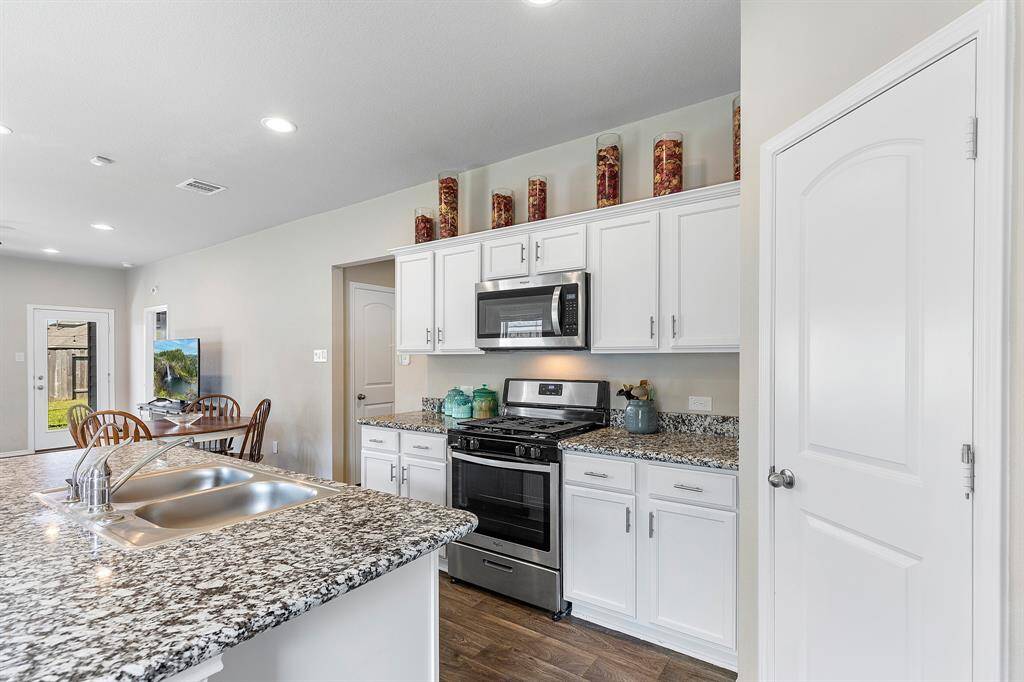 Whip up meals while staying connected with guests at the dining table or catching the game in the living room.