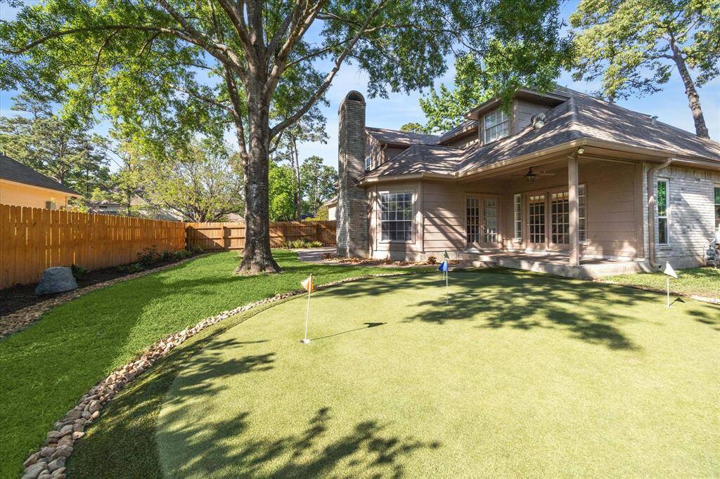 Second covered patio and custom putting green