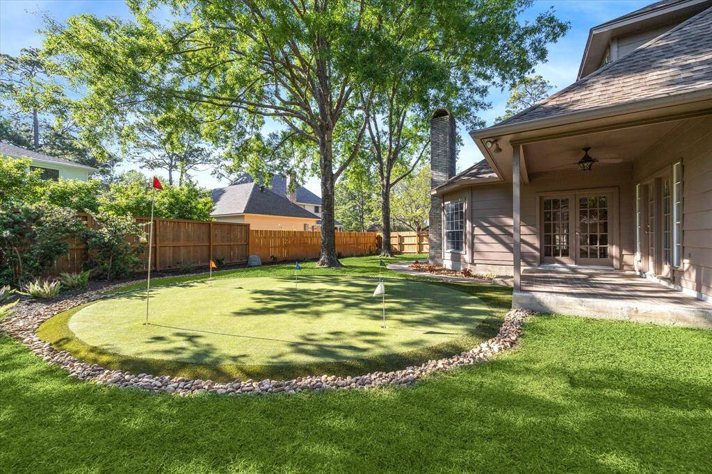 Custom putting green and two covered patios and new fencing