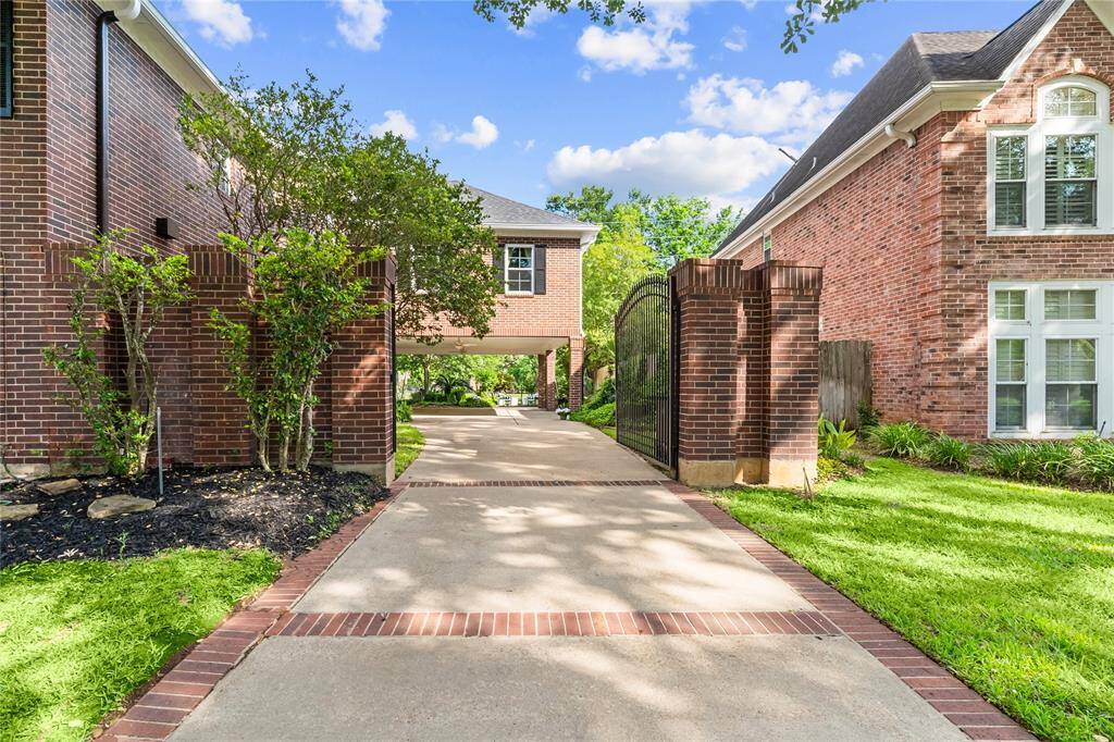 RELAX UNDER THE SHADED COVERED PATIO OVERLOOKING A WELL-MANICURED YARD AND A SEATING AREA THAT OPENS TO GOLF COURSE VIEWS.
