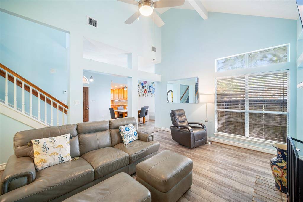 Natural light through the windows of the den, creating a bright and welcoming atmosphere.