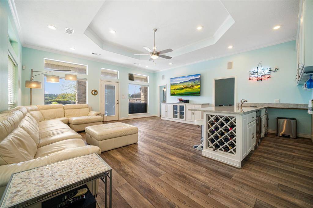 Ideal for gatherings, this expansive family room offers comfort, style and fun.