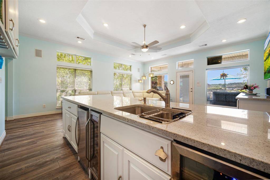 Experience ultimate entertainment in the family room with a sleek, fully-equipped bar.
