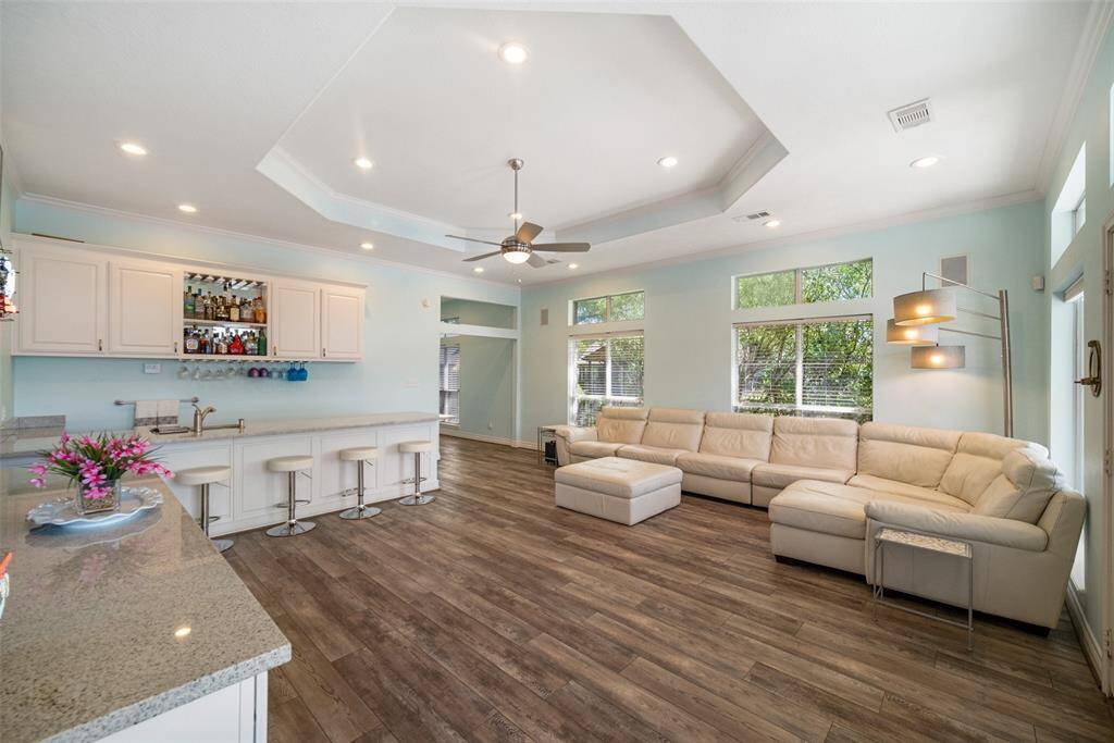 Ideal for entertaining, this spacious family room effortlessly accommodates large gatherings.