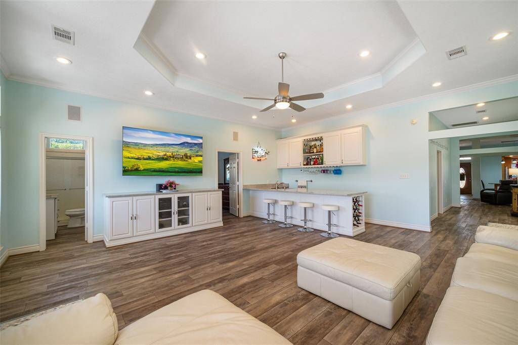Experience the ultimate entertainment in the family room, complete with a flatscreen TV included.