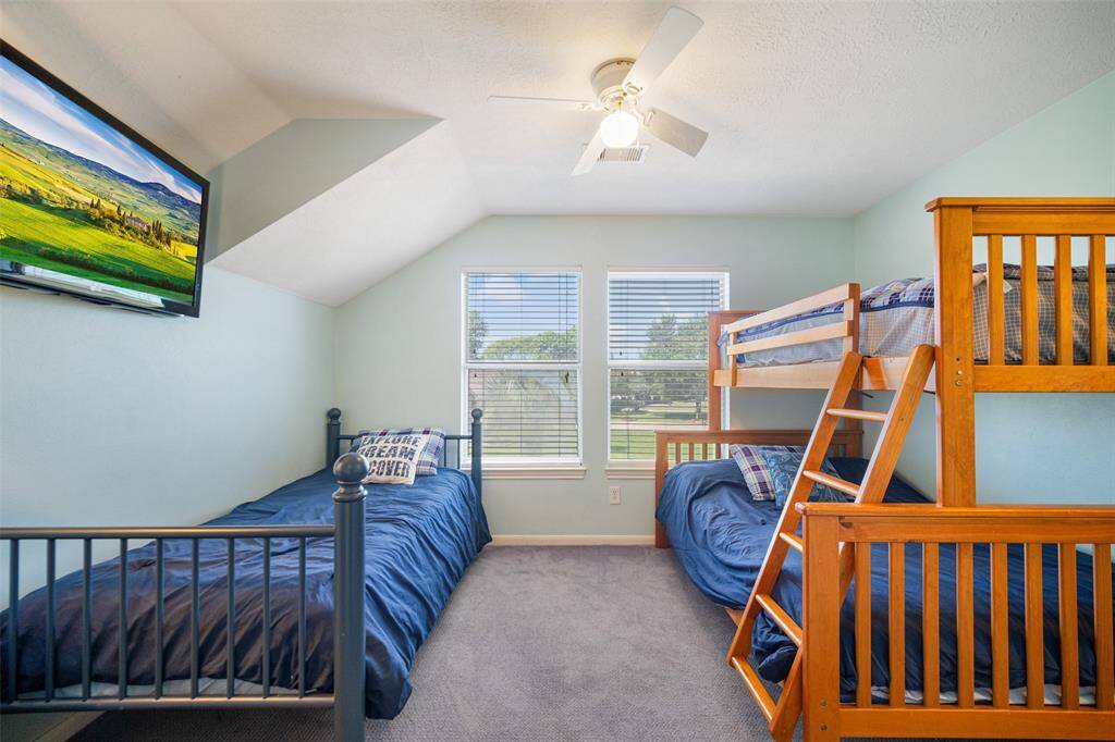 The open loft is currently set up as an additional bedroom, providing a perfect space for family and friends when they visit, but could also be used as a game room.