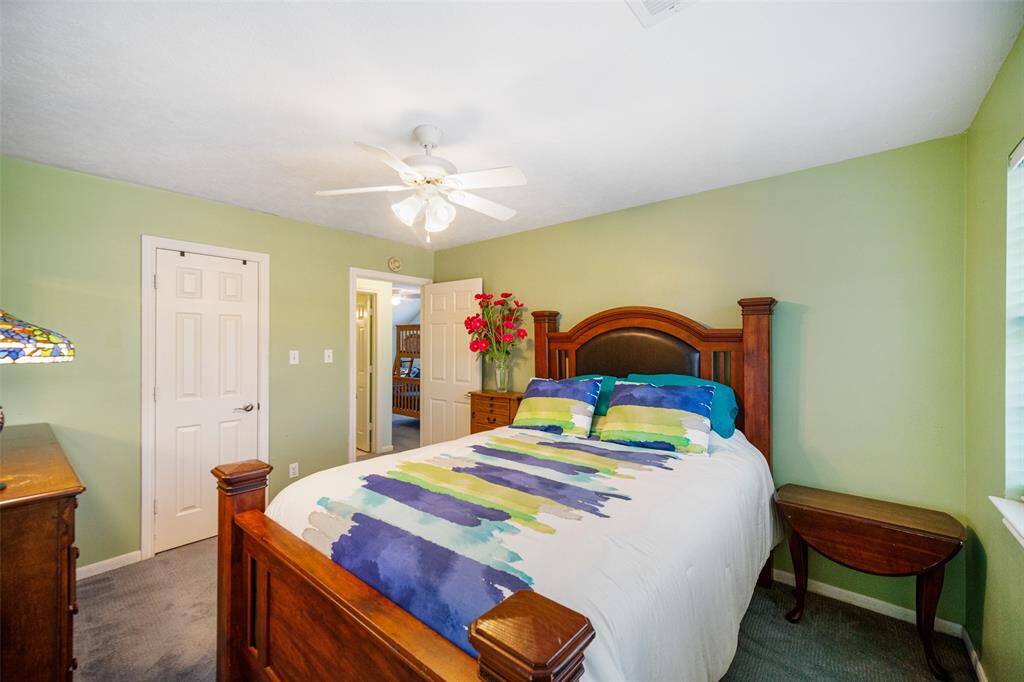 One of two secondary bedrooms located upstairs.