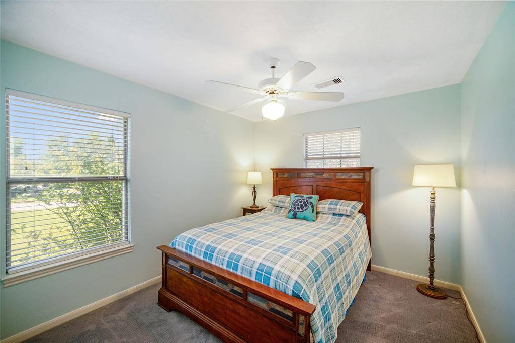 Two of two secondary bedrooms located upstairs.