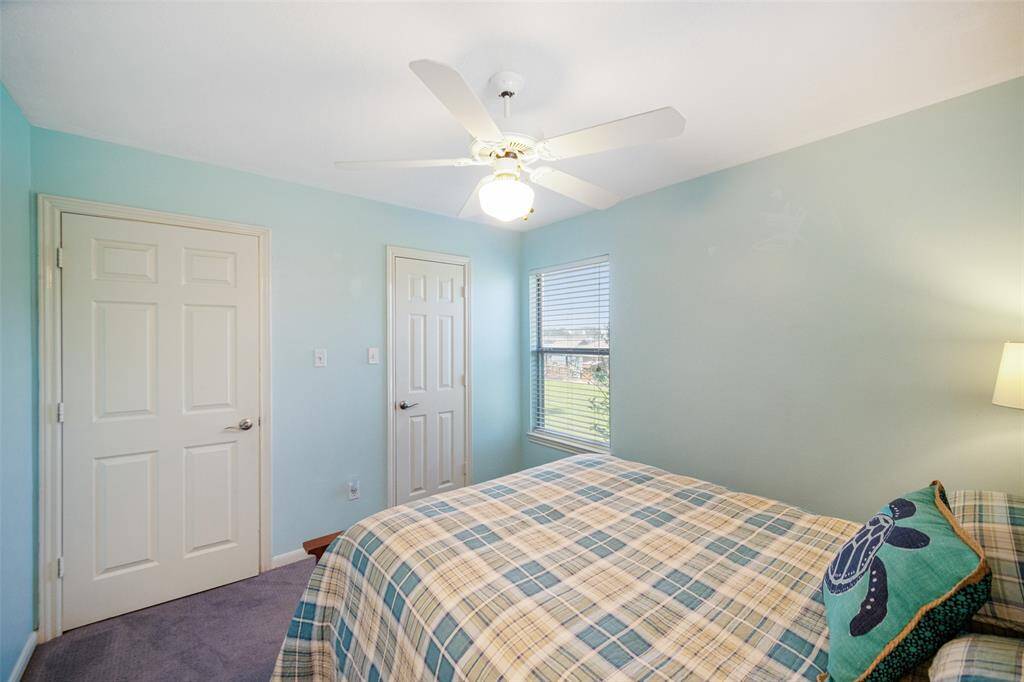 This cozy bedroom features soft carpet flooring and a closet.