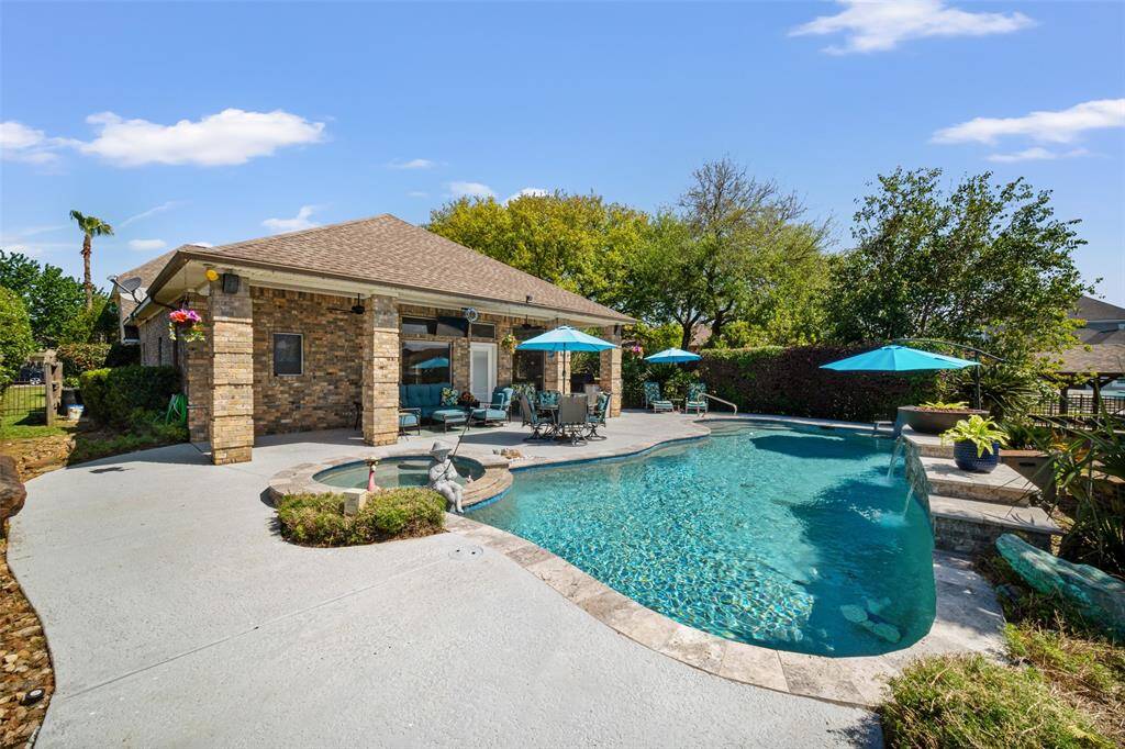 This alternate, lovely view of your backyard oasis showcases the serene setting and thoughtfully designed outdoor living space.