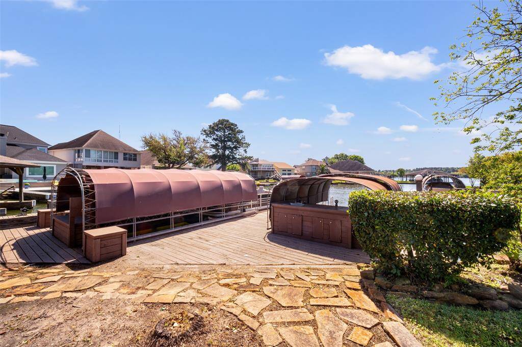 A stone pathway leads you right to your boat docks, making it easy to take full advantage of boat access to Lake Conroe.