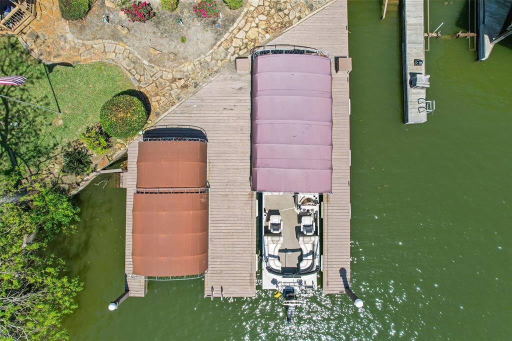The aerial view of the boat docks highlights the seamless connection between the dock and Lake Conroe.
