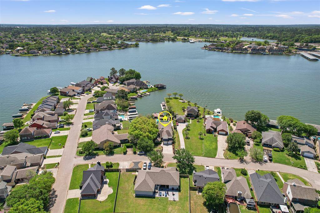 This front aerial view of the home offers perspective of the home within the community.