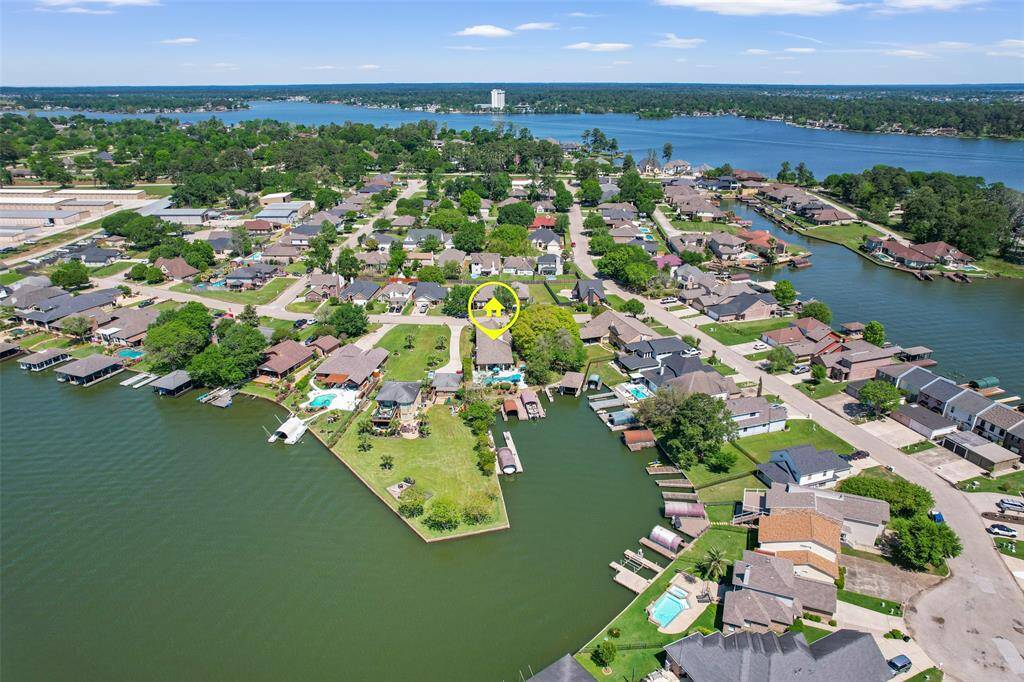 This back aerial view of the property provides a clear perspective of its close proximity to the water.