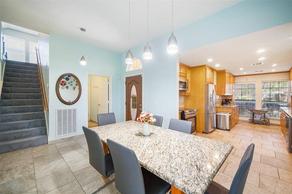 The breakfast room is open to the galley kitchen, allowing for an effortless flow between the two rooms.