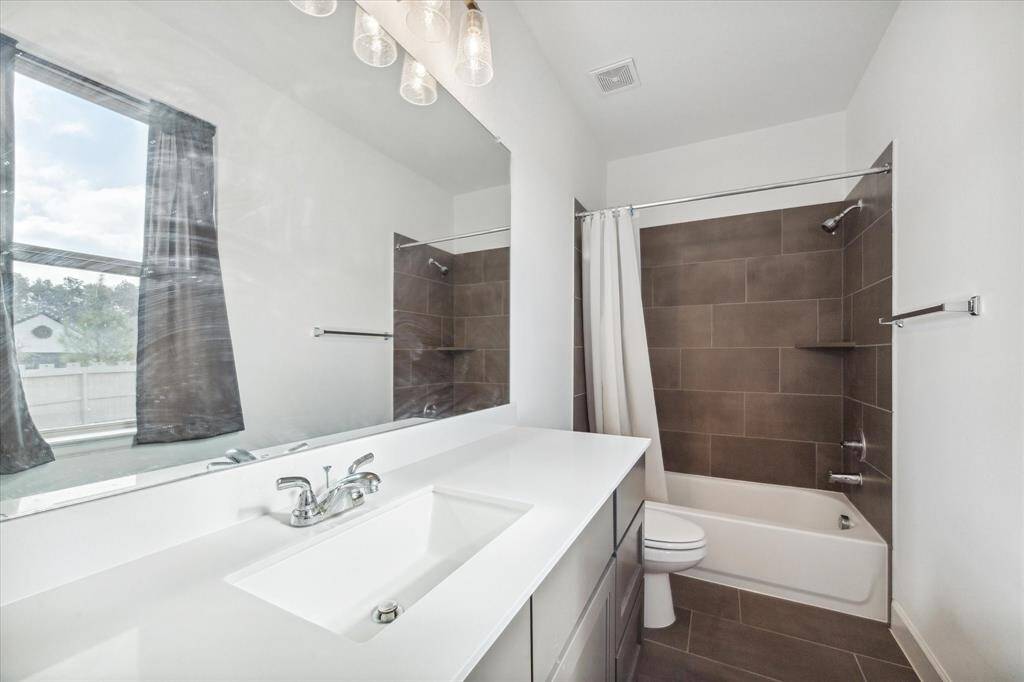 Secondary bathroom features atub/shower combo and long vanitywith plenty of counter space.
