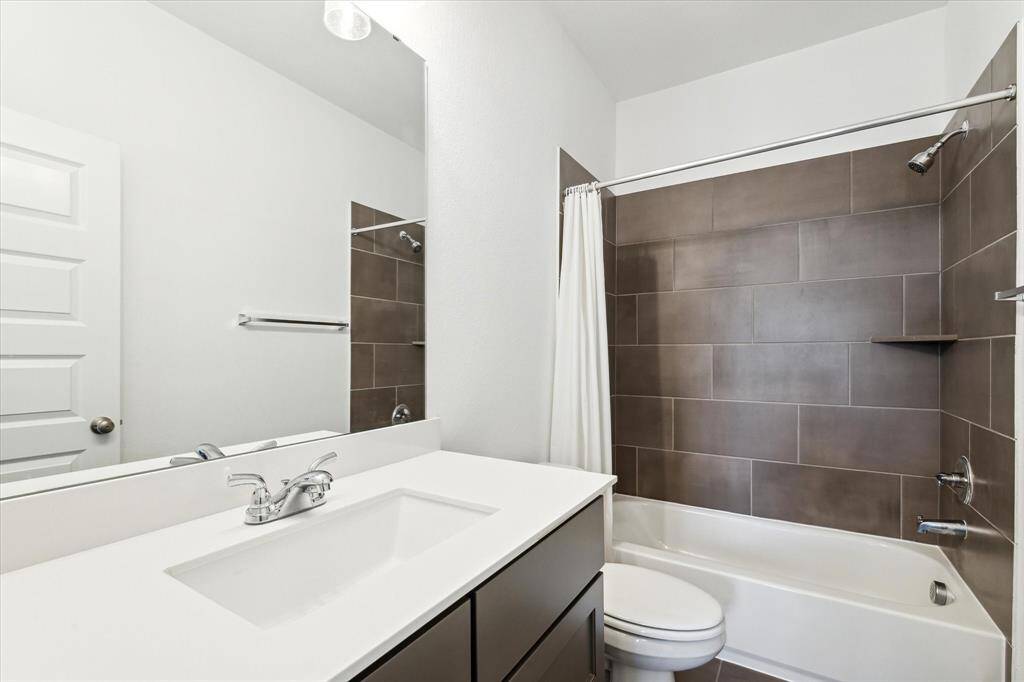 Third bathroom features atub/shower combo and long vanitywith plenty of counter space.