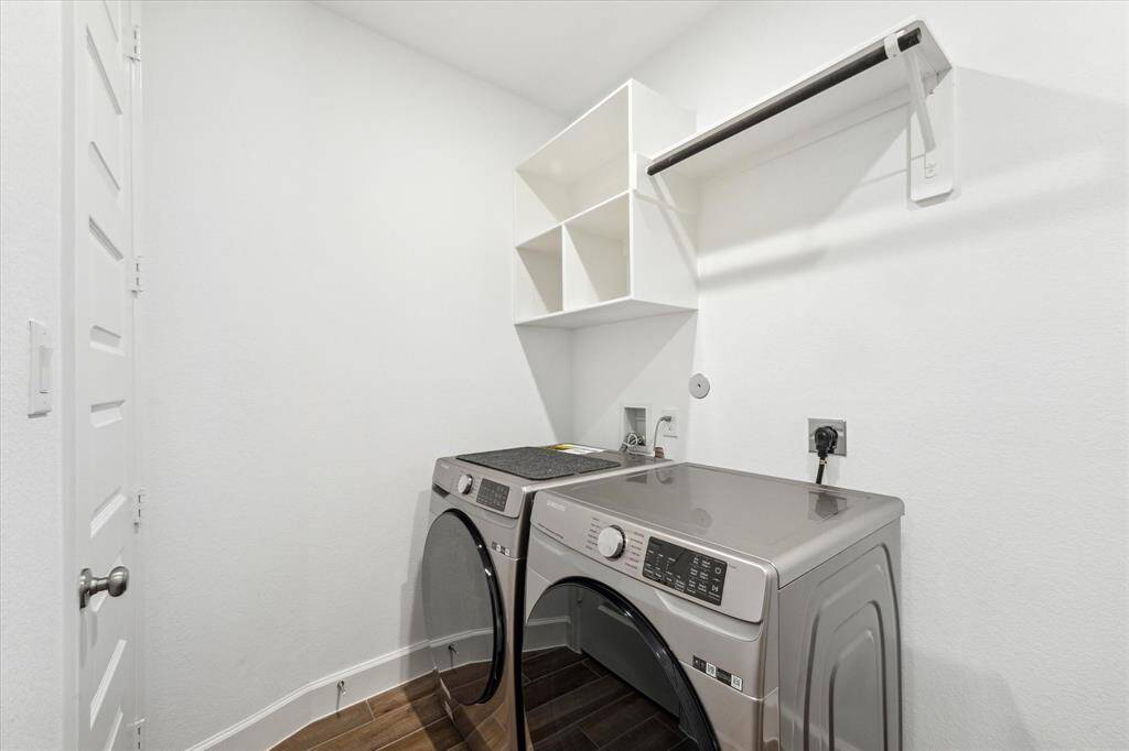 The laundry room features tile floors,washer and dryer connections, andplenty of storage space.