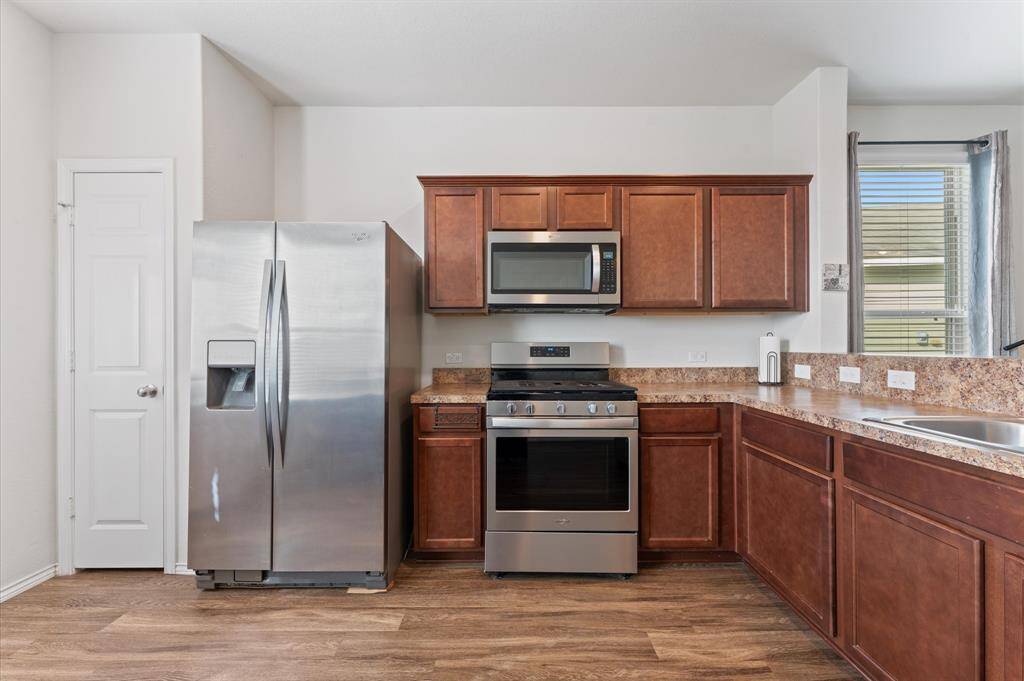 Stainless steel appliances, with stainless steel modern refrigerator being included!