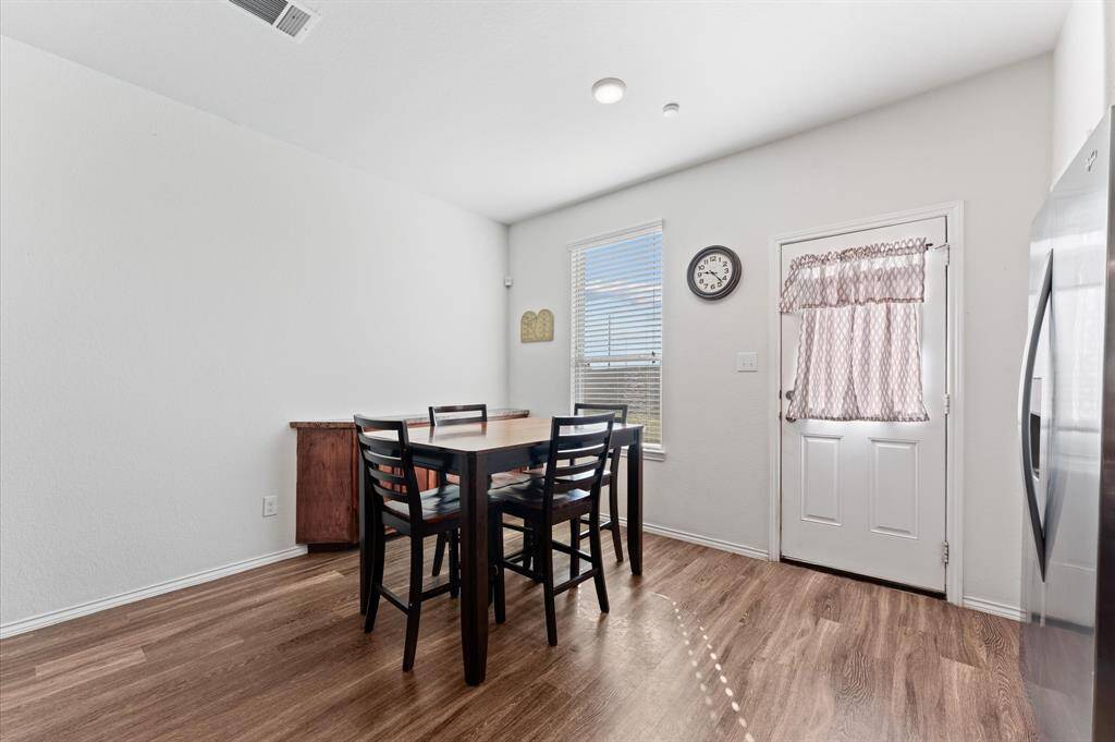 The spacious eating area with a handmade buffet to match the cabinets.
