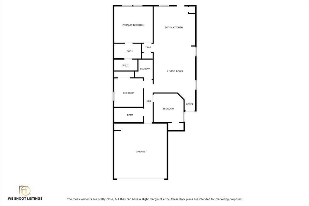 This is a floor plan of the home featuring three bedrooms, including a primary bedroom with an ensuite bath and walk-in closet. It has an eat-in kitchen, a living room, a separate laundry area, and a foyer. The layout includes two additional bathrooms and a garage.