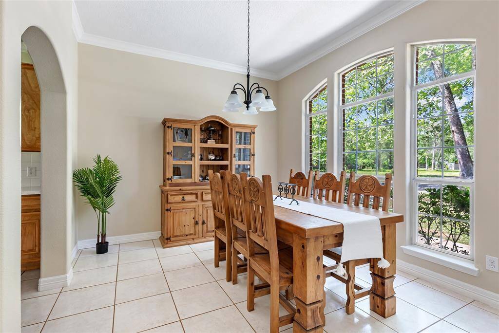 Elegant and spacious, this formal dining room easily accommodates a large dining table and buffet, making it perfect for hosting family gatherings or dinner parties.