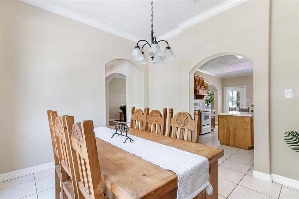 Designed for both elegance and functionality, this formal dining room offers the perfect setting for special occasions and holiday meals.