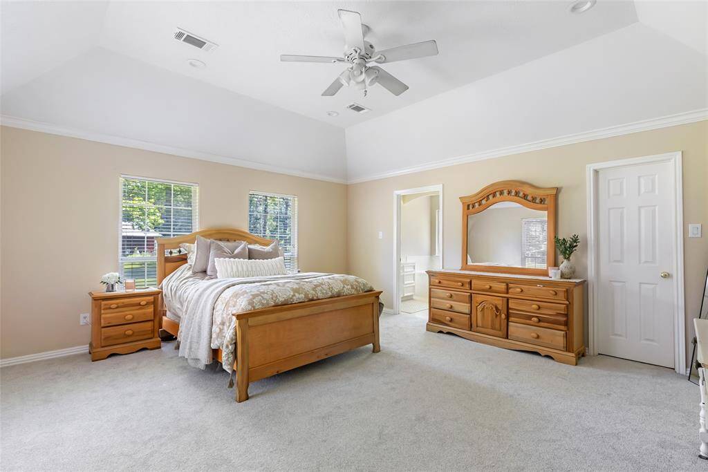Relax and unwind in the luxurious primary suite, complete with trey ceilings, crown molding, and plenty of room for your favorite furnishings.