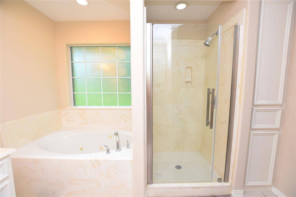 This expansive bedroom offers plenty of room for your furniture and personal touches, with large windows that let in an abundance of sunlight. A comfortable, airy space for relaxation or productivity.