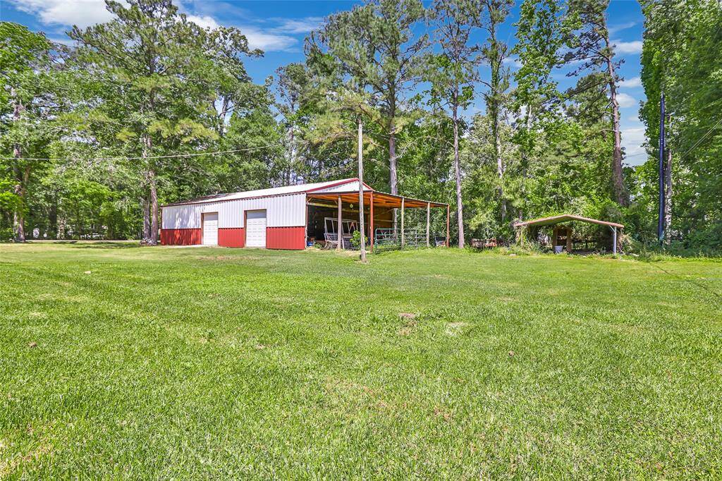 This spacious workshop is designed for both functionality and convenience, featuring three large doors that make it easy to access and move equipment in and out.