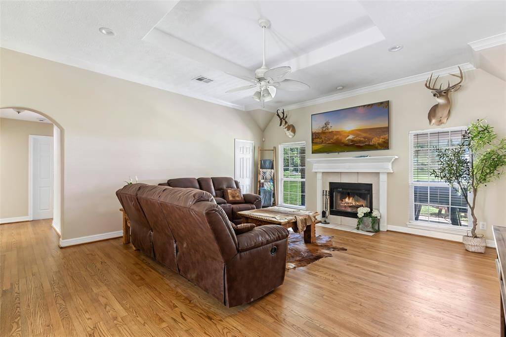 The centerpiece of the living room, this elegant fireplace adds warmth and charm with its timeless design.
