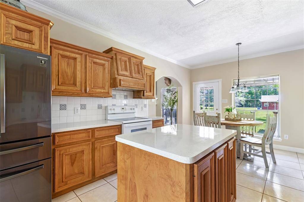 Bright and functional, this well-appointed kitchen features a cozy island that’s perfect for meal prep, casual dining, or extra storage.