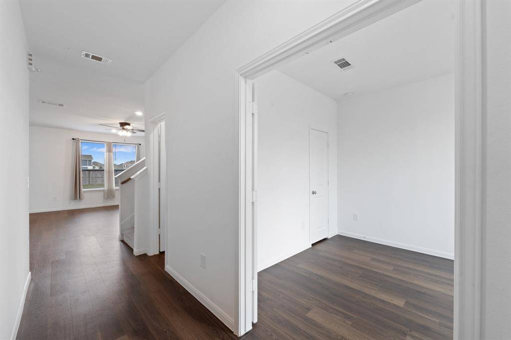 Welcoming entryway, greeting visitors with wood-look flooring.