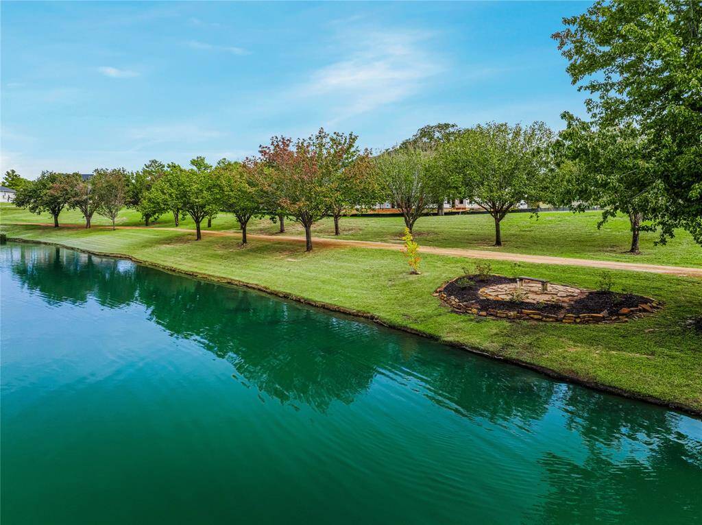 This tree lined walking path is maintained by the HOA and is right out your back door...
