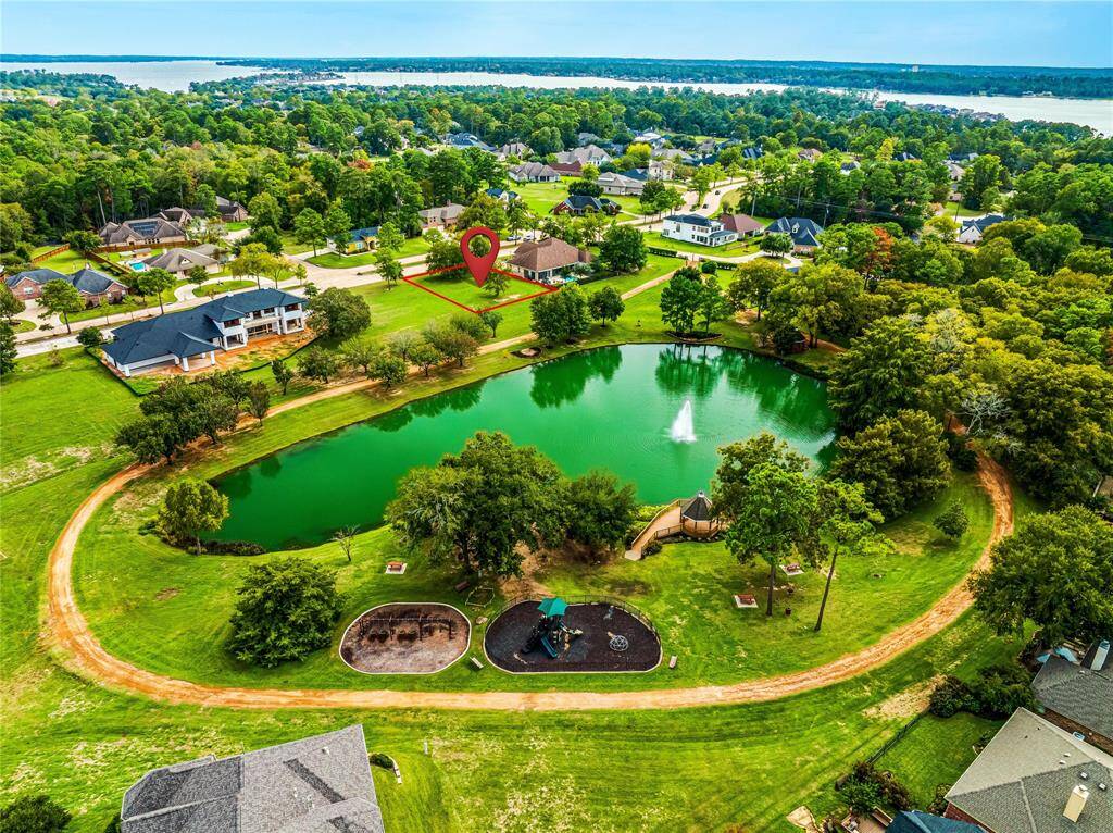 Aerial view showing the defined lot, the Park in the Meadows and the close proximity to beautiful Lake Conroe!