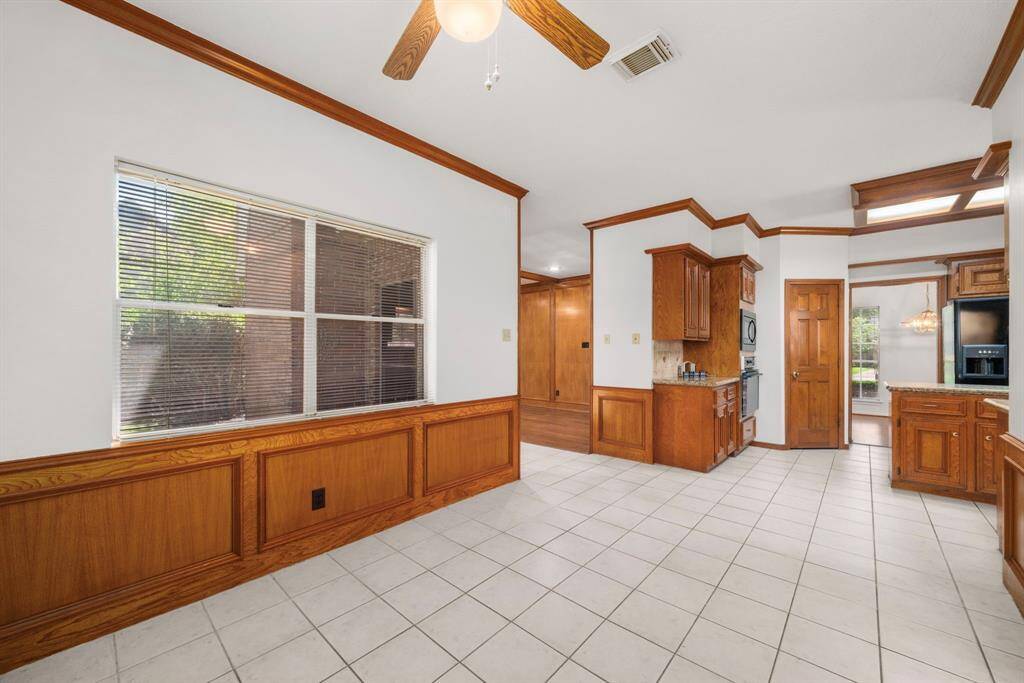 This view shows where the breakfast room opens to the kitchen and family room and flows seamlessly to the Formal Dining Room on the other side of the Kitchen. Isn't this a great spot for holiday entertaining and extended family gatherings?