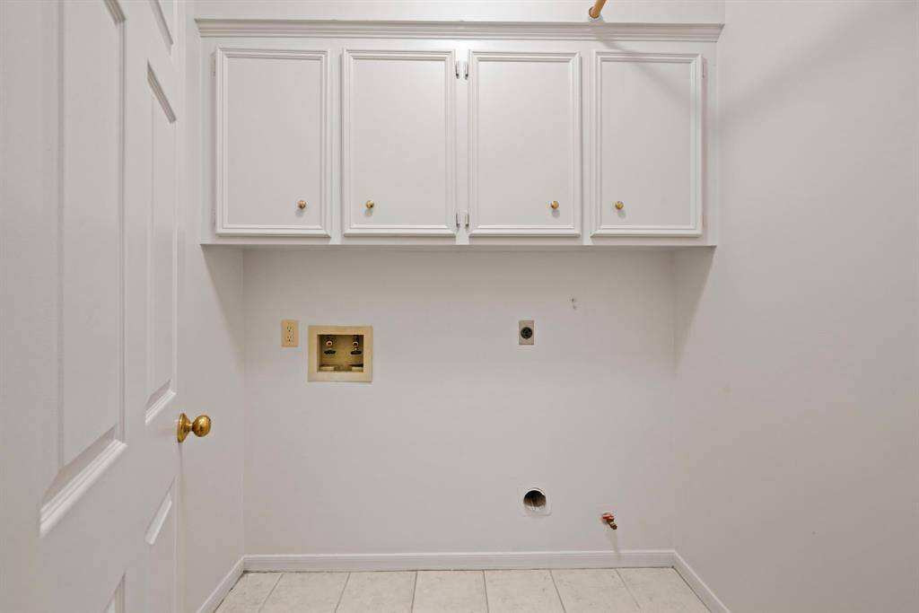 The downstairs utility room offers connections for an electric washer, electric dryer, and a gas dryer.  The cabinets provide a place for your cleaning supplies.