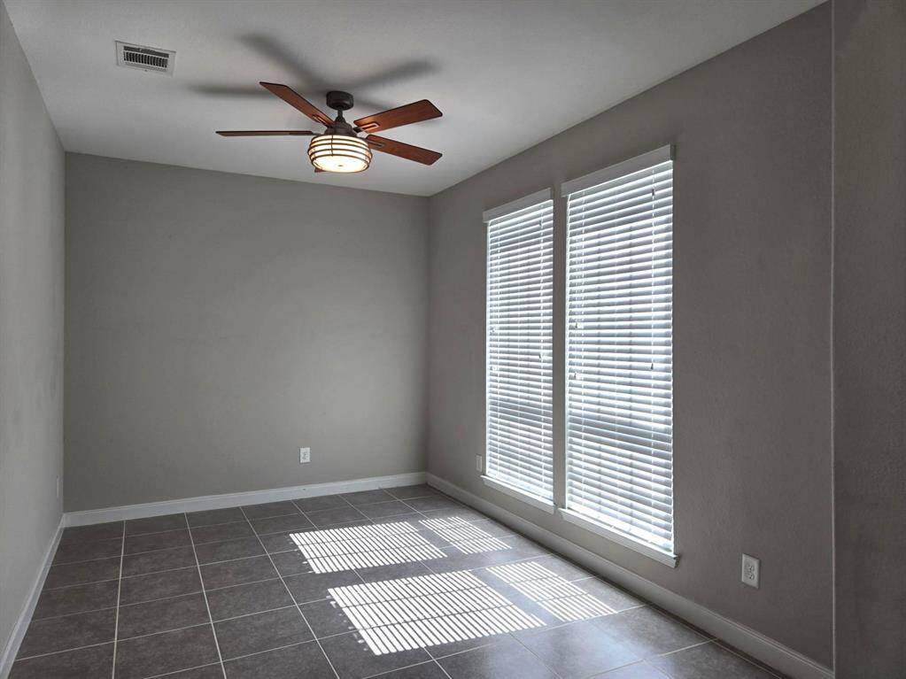 One more view of flex room with ceiling fan! Great natural light!