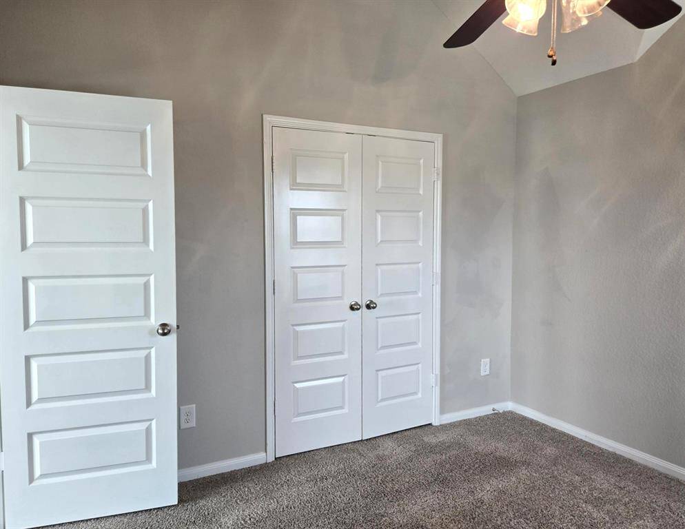 Closet with double doors in ensuite bedroom up.