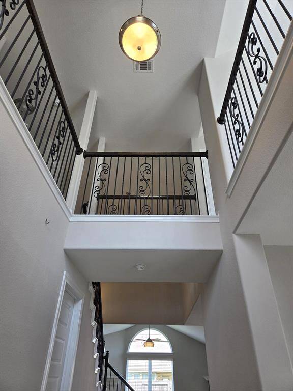 Grand two story entrance with soaring ceiling!Door on left is the laundry room with access to door to garage.