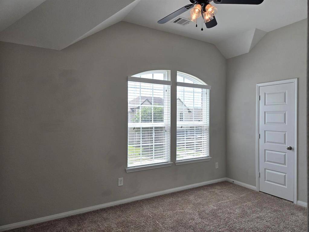 One of the bedrooms upstairs with walk in closet.