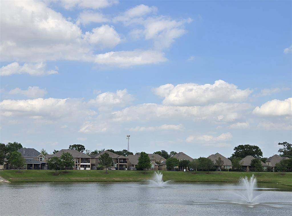 Tranquil view of the blue waters of the subdivision lake and fountains!
