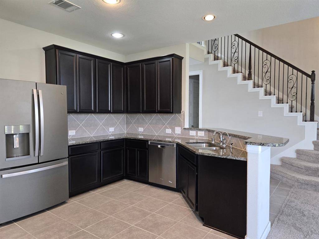 Chef's dream kitchen! Trendy sleek granite countertops!