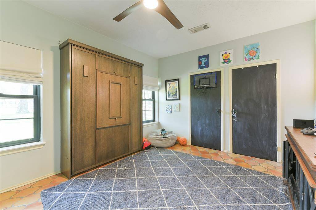 Optional 4th room/Flex space downstairs with a Murphy bed (negotiable).  Door currently painted in chalkboard.  Roman shades provide privacy when used as a bedroom.