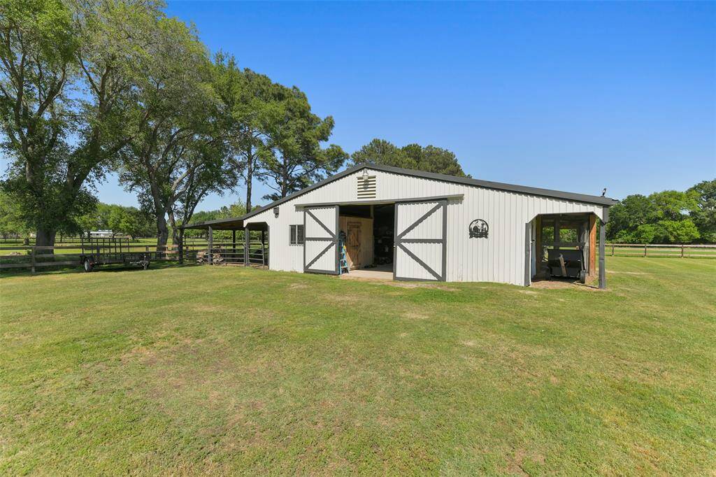 Barn provides 4 stalls for horses/animals and has a chicken coop with plenty of additional room for storage.