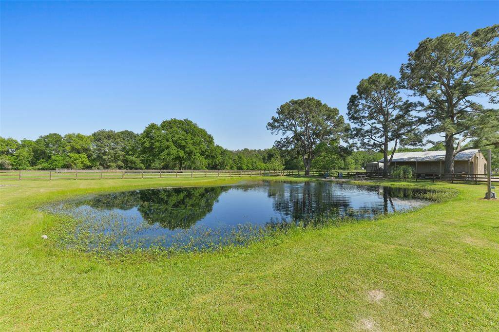Stocked aerated Pond in the back acreage is stocked with Bass and Bluegill and has a newly installed pond deck with firepit.