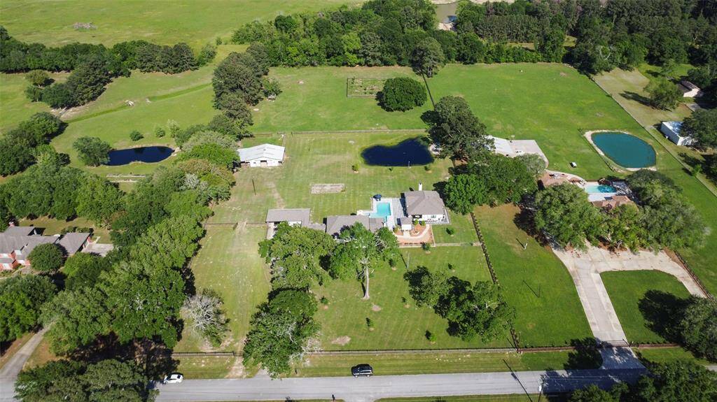 Nearly 5 acre gated estate with total privacy and all the special features you would want in  your very own Texas Ranchette--welcome home to 18203 Kitzman Road in Cypress.